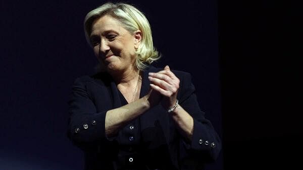 <div class="paragraphs"><p>Marine Le Pen, French far-right leader and far-right Rassemblement National (National Rally - RN) party candidate, reacts on stage after partial results in the first round of the early French parliamentary elections in Henin-Beaumont, France, June 30, 2024.</p></div>