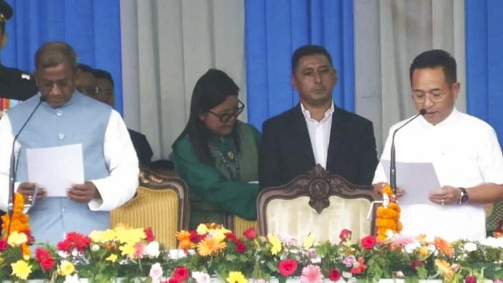 <div class="paragraphs"><p>Sikkim Governor Lakshman Prasad Acharya administers the oath of office and secrecy to Chief Minister-designate Prem Singh Tamang during the swearing-in ceremony, in Gangtok, Monday, June 10, 2024.</p></div>