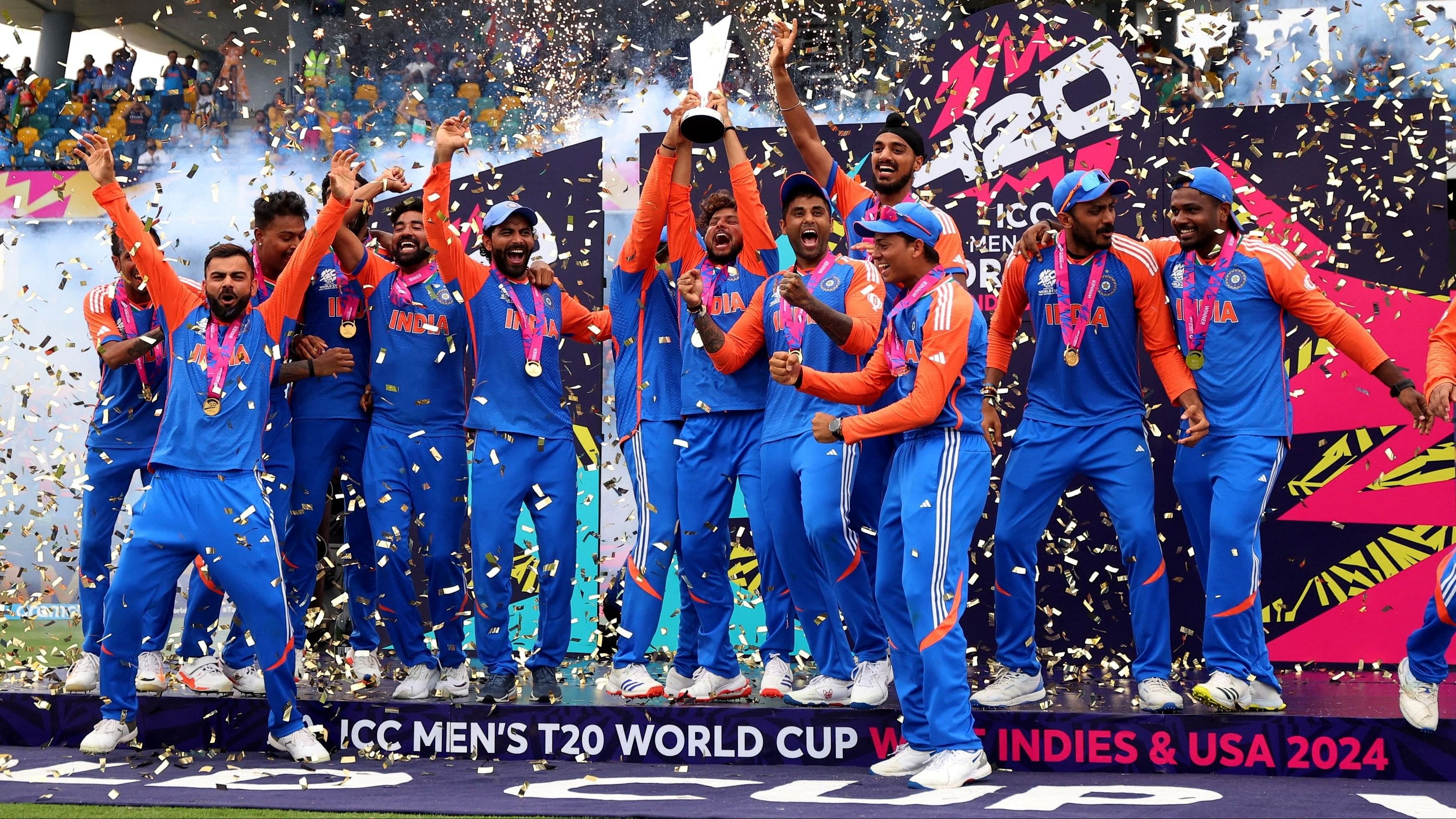 <div class="paragraphs"><p>Kuldeep Yadav lifts the trophy as they celebrate after winning the T20 World Cup.</p></div>