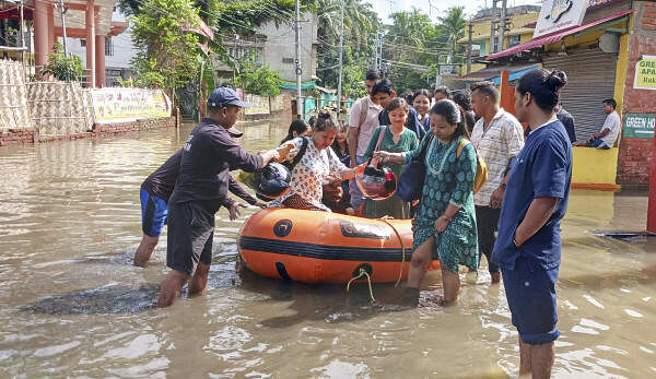 <div class="paragraphs"><p>SDRF personnel rescue people from a flooded area, following incessant rains, in Assam.</p></div>