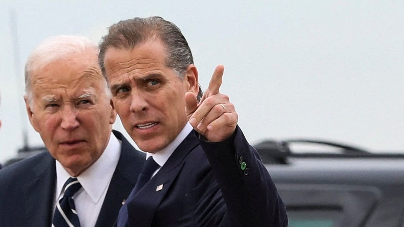 <div class="paragraphs"><p>US President Joe Biden stands with his son Hunter Biden.</p></div>