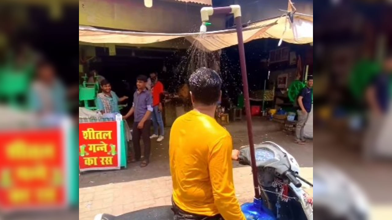 <div class="paragraphs"><p>Screengrab from a video showing the man's scooter that has a shower installed.</p></div>