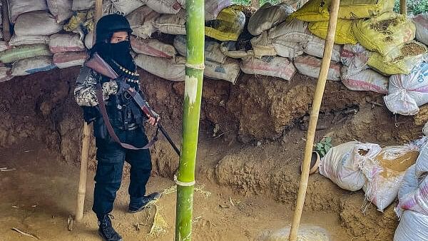 <div class="paragraphs"><p>A 'village volunteer' stands guard at a bunker set up in conflict-hit Manipur.</p></div>