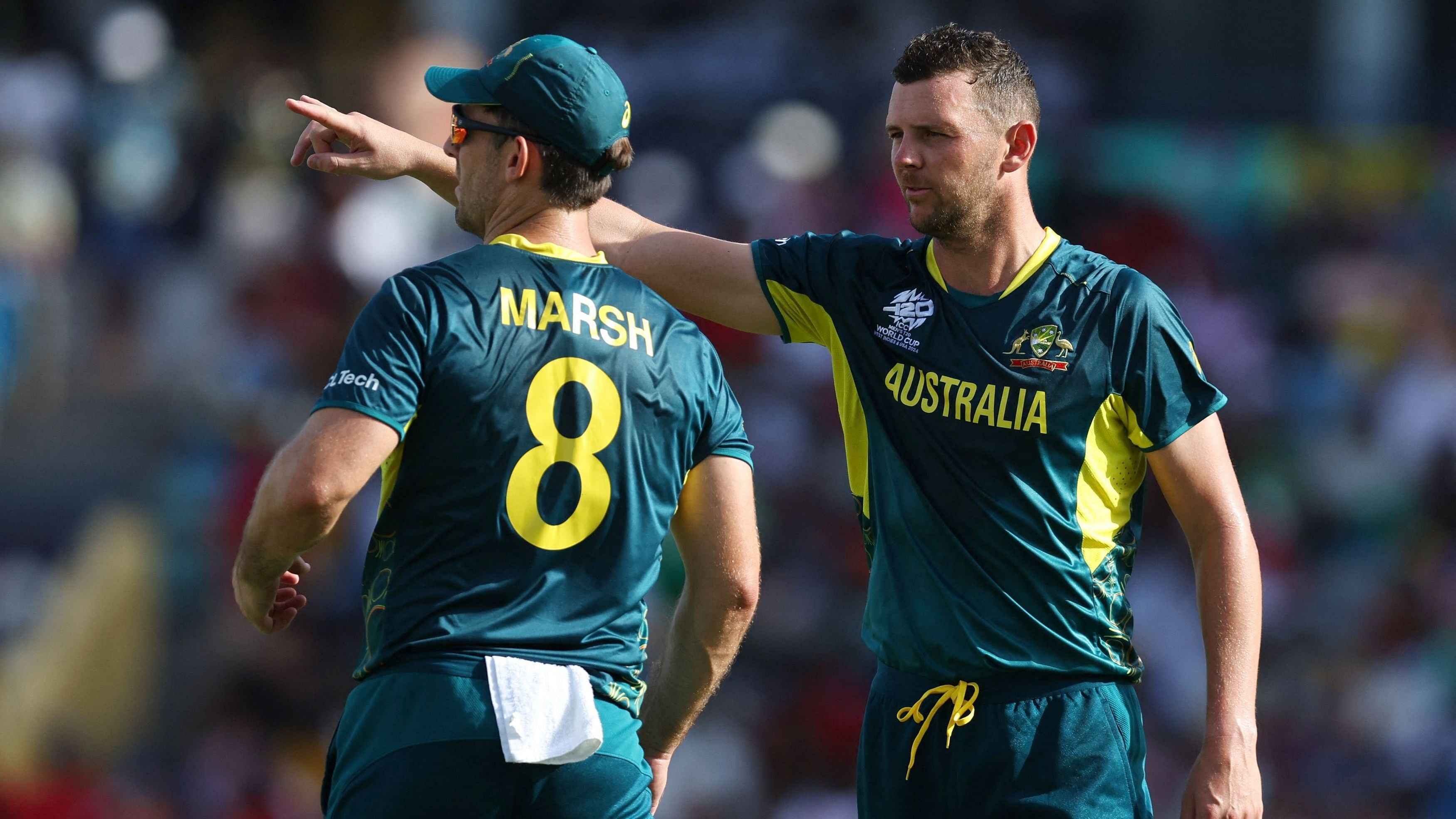 <div class="paragraphs"><p>Australia's Josh Hazlewood and Mitchell Marsh talk during a match.</p></div>