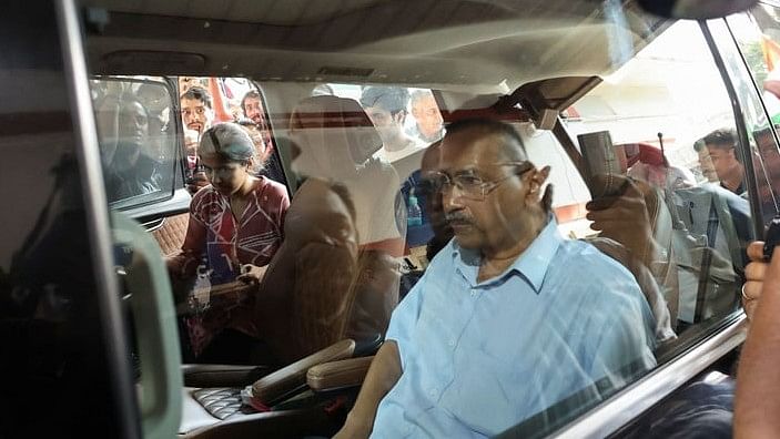 <div class="paragraphs"><p>Delhi Chief Minister Arvind Kejriwal sits in his car as he leaves to surrender himself to jail authorities, after interim bail granted by the Supreme Court in a liquor policy case came to an end, in New Delhi, India, June 2, 2024. </p></div>