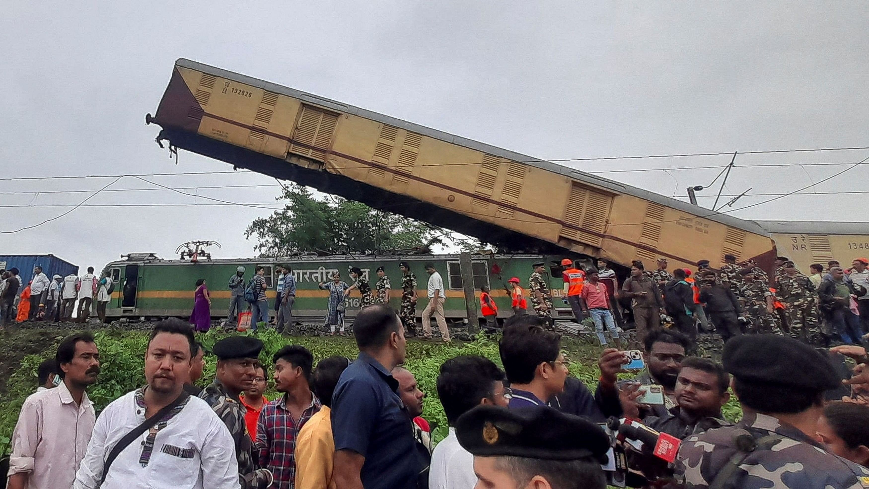 <div class="paragraphs"><p>Rescue workers along with people gather at the site of the train collision after the accident in Darjeeling district, West Bengal.</p></div>