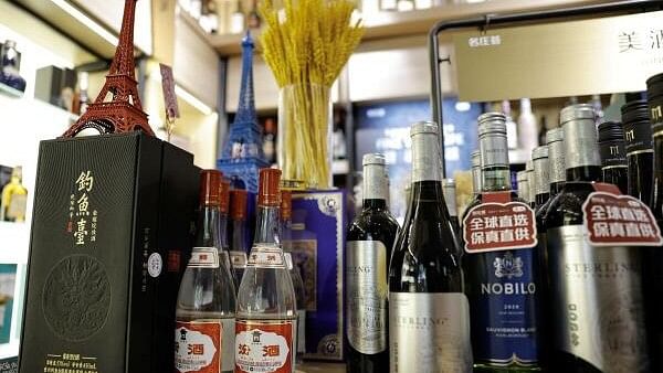 <div class="paragraphs"><p>Chinese spirit Baijiu are displayed next to bottles of wine inside a liquor store in Beijing.</p></div>