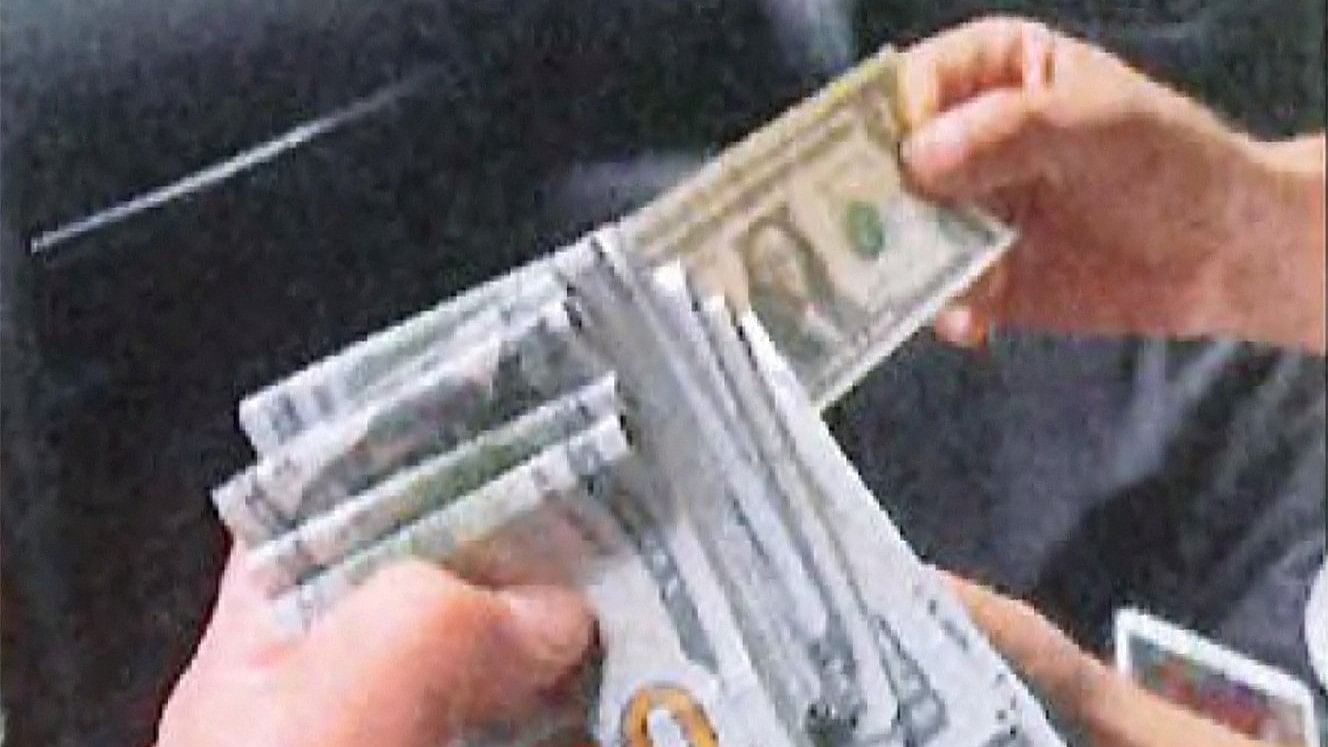 <div class="paragraphs"><p>This file photo shows An undercover U.S. law enforcement officer being handed $15,000, described by the US Department of Justice as the advance cash payment, by an associate of Nikhil Gupta, who was charged with orchestrating the attempted murder of a Sikh separatist Pannun, in a car in the Manhattan borough of New York City, U.S. June 9, 2023</p></div>