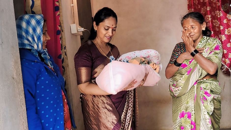 <div class="paragraphs"><p>State women's panel chief Dr Nagalakshmi Chowdhary (centre) with the 'exiled' new mother (left) in Bisadahalli village in Tumakuru on Monday.&nbsp; </p></div>