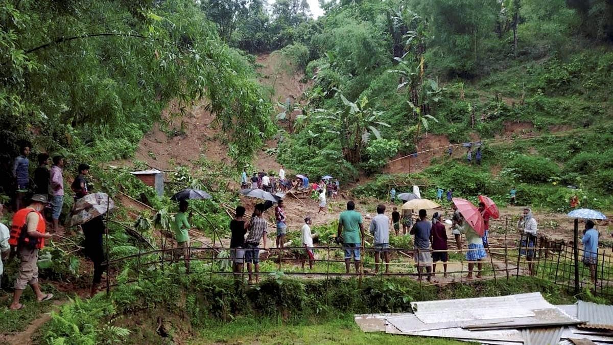 <div class="paragraphs"><p>Locals gather at the spot where the landslide occurred in Karimganj, Assam.</p></div>