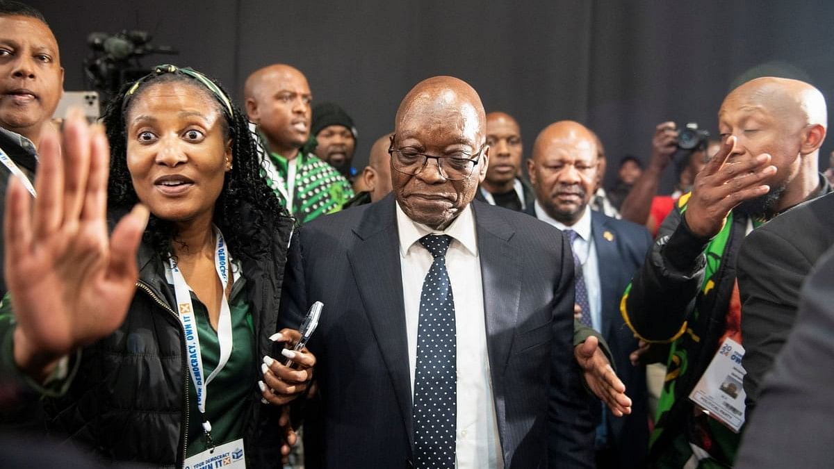 <div class="paragraphs"><p>South Africa's former President Jacob Zuma arrives with his daughter and member of uMkhonto weSizwe  Duduzile Zuma at the National Results Operation Centre of the IEC, which serves as an operational hub where results of the national election are displayed in Midrand, South Africa.</p></div>