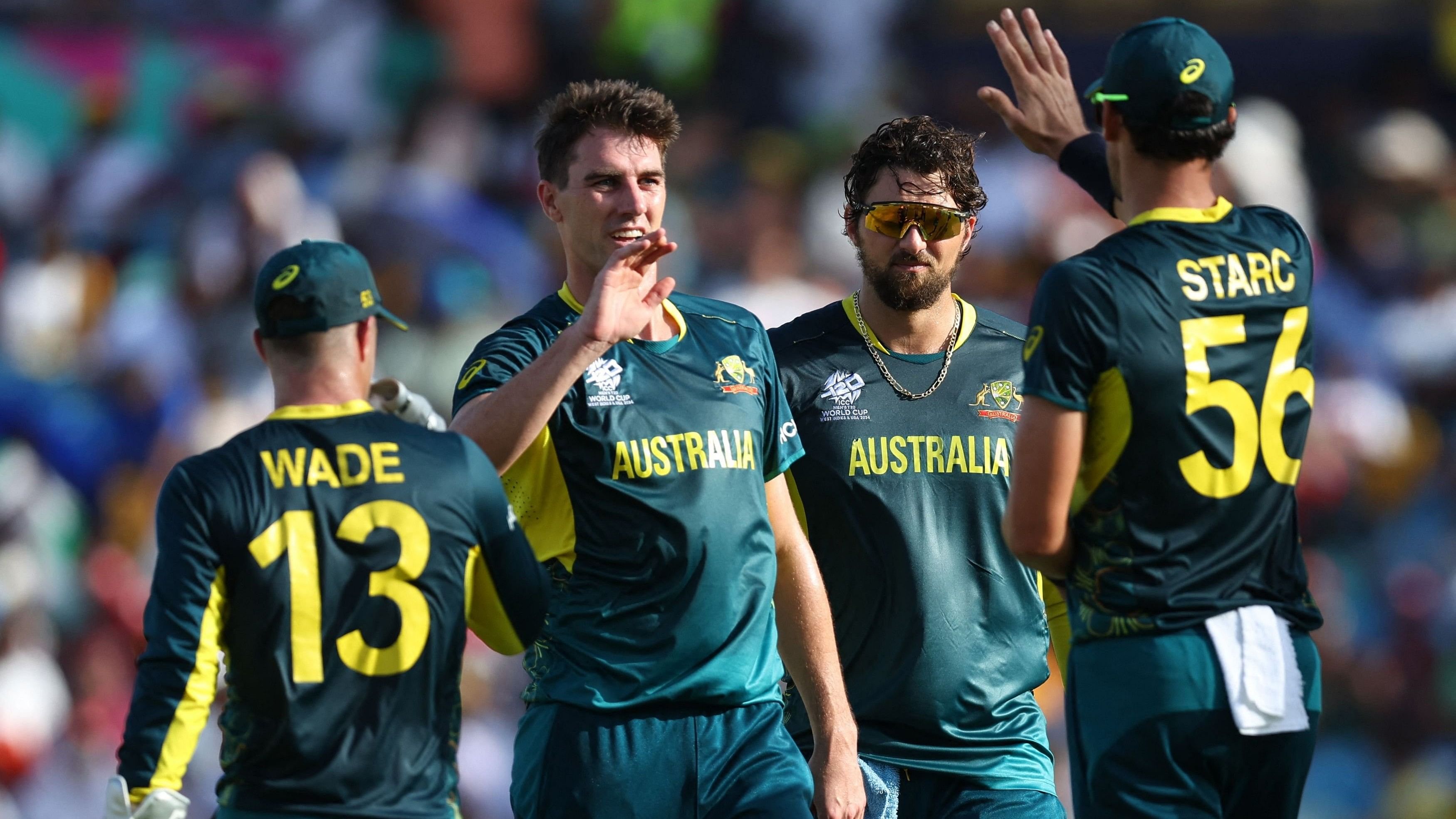 <div class="paragraphs"><p> Australia's Pat Cummins (second from left) celebrates with teammates.</p></div>