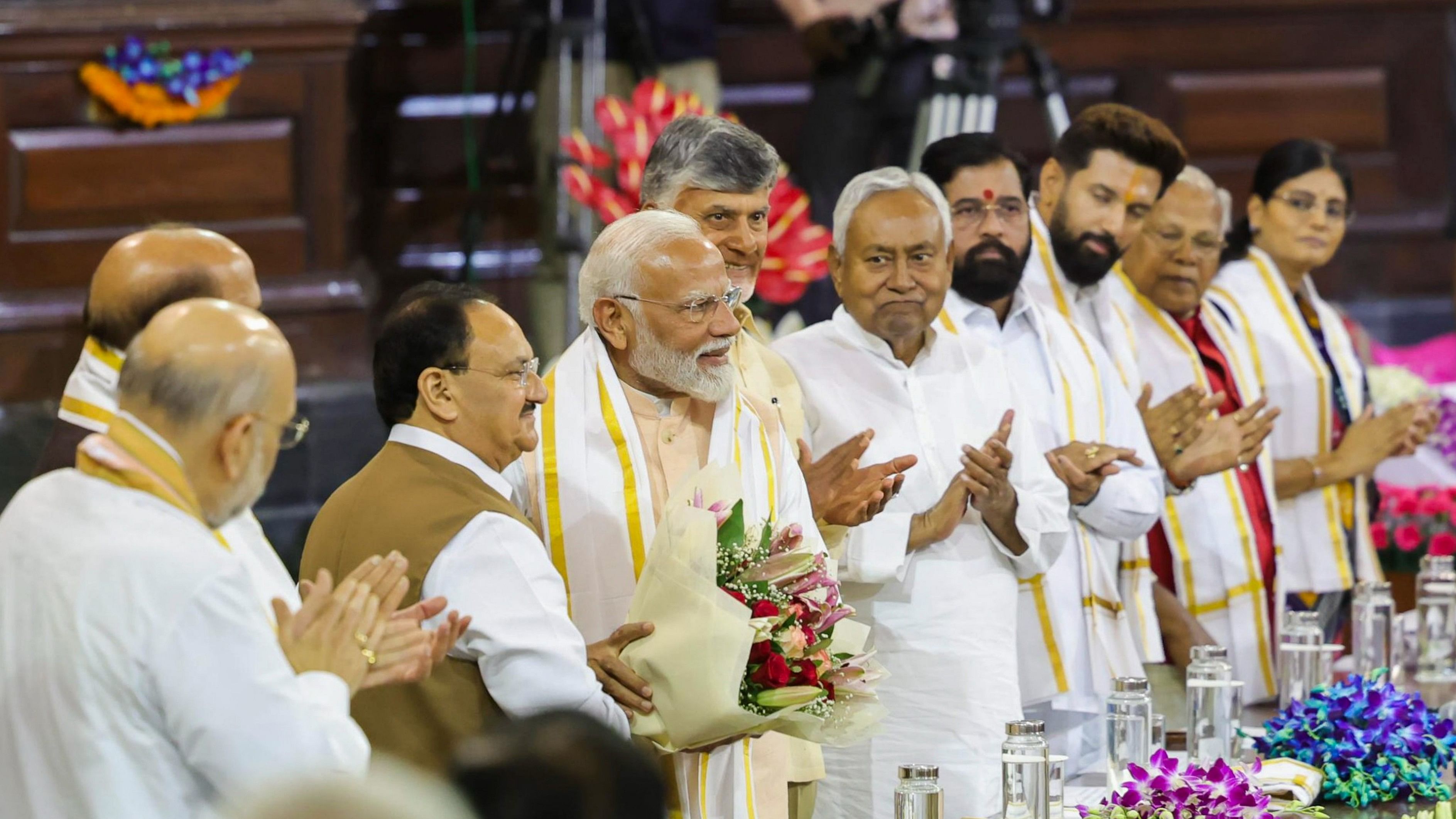 <div class="paragraphs"><p>BJP President Jagat Prakash Nadda welcomes Prime Minister Narendra Modi during the NDA parliamentary party meeting at Samvidhan Sadan, in New Delhi, Friday.</p></div>