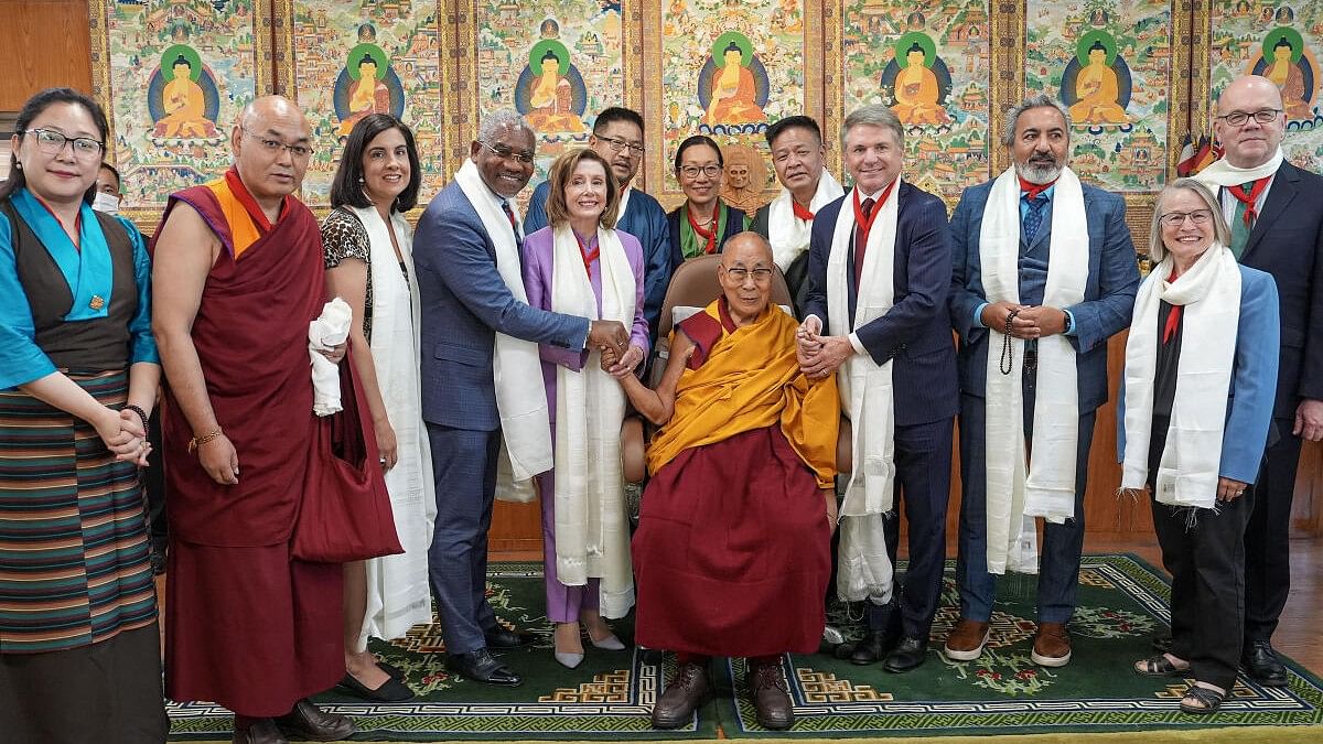 <div class="paragraphs"><p>Tibetan spiritual leader Dalai Lama (C) with former US House of Representatives Speaker Nancy Pelosi and other members of the US Congressional delegation after a meeting at his residence, in Dharamsala, Wednesday, June 19, 2024.</p></div>