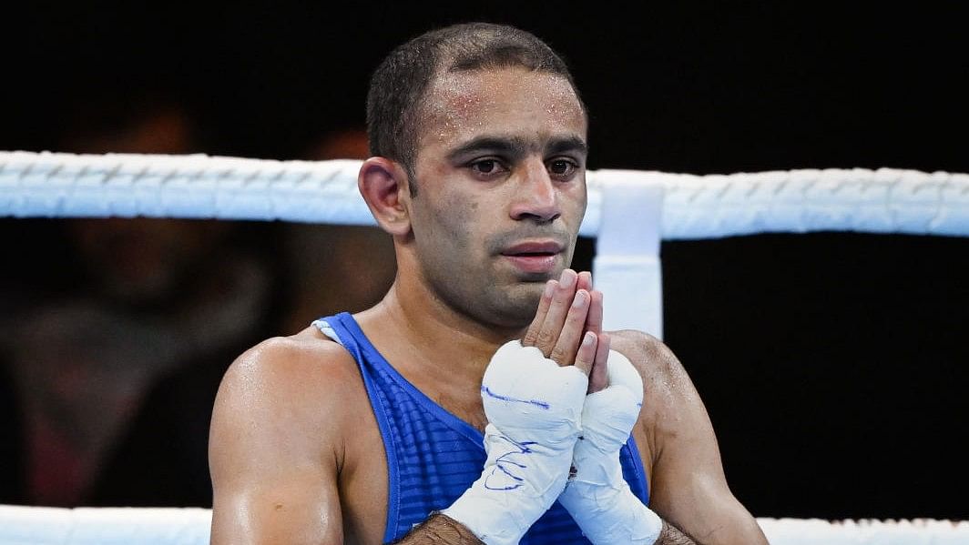 <div class="paragraphs"><p>File Photo:&nbsp;India's Amit Panghal reacts after winning the semi-final match of the men’s over 48kg-51kg (Flyweight) boxing event against Zambia's Patrick Chinyemba, at the Commonwealth Games 2022 (CWG), in Birmingham, UK.</p></div>