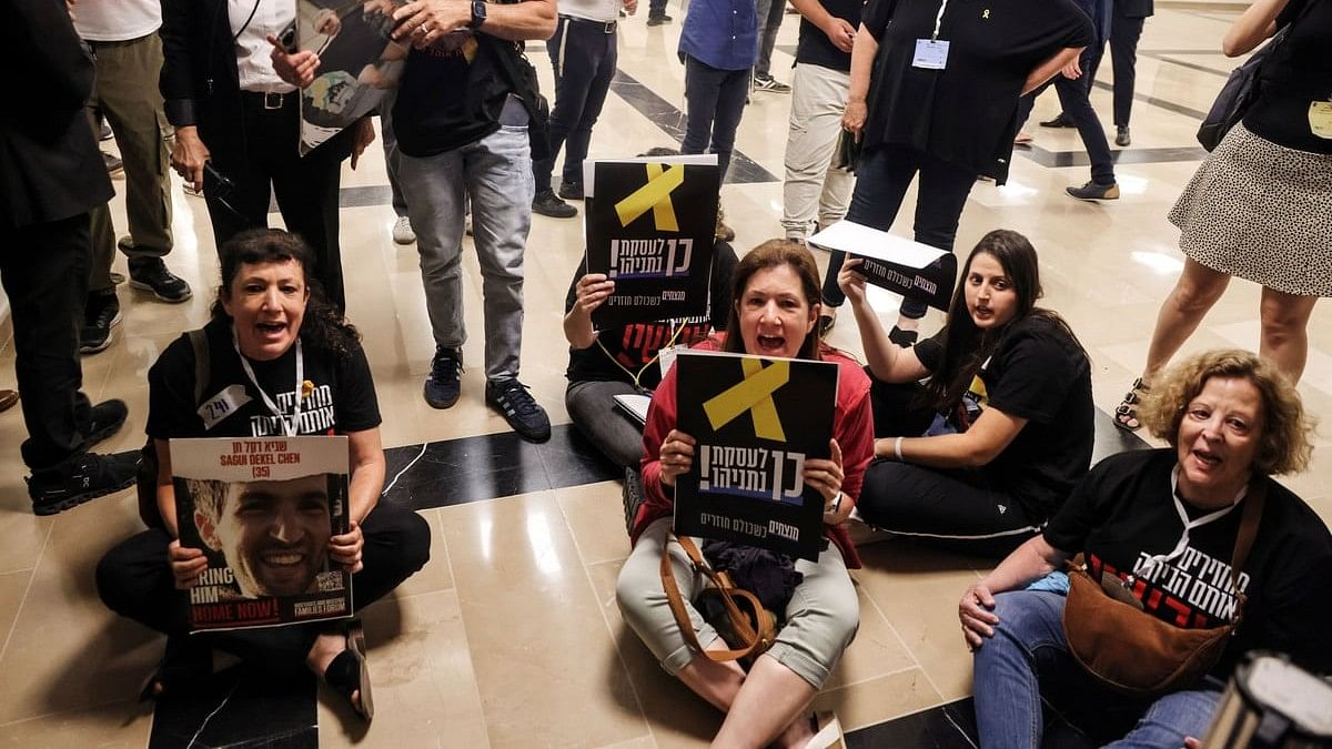 <div class="paragraphs"><p>Families and supporters of hostages kidnapped during the deadly October 7 attack on Israel by the Palestinian Islamist group Hamas, protest outside the room where Israeli National Security Minister Itamar Ben-Gvir holds his party faction meeting at the Knesset, Israel's parliament, in Jerusalem June 3, 2024. </p></div>