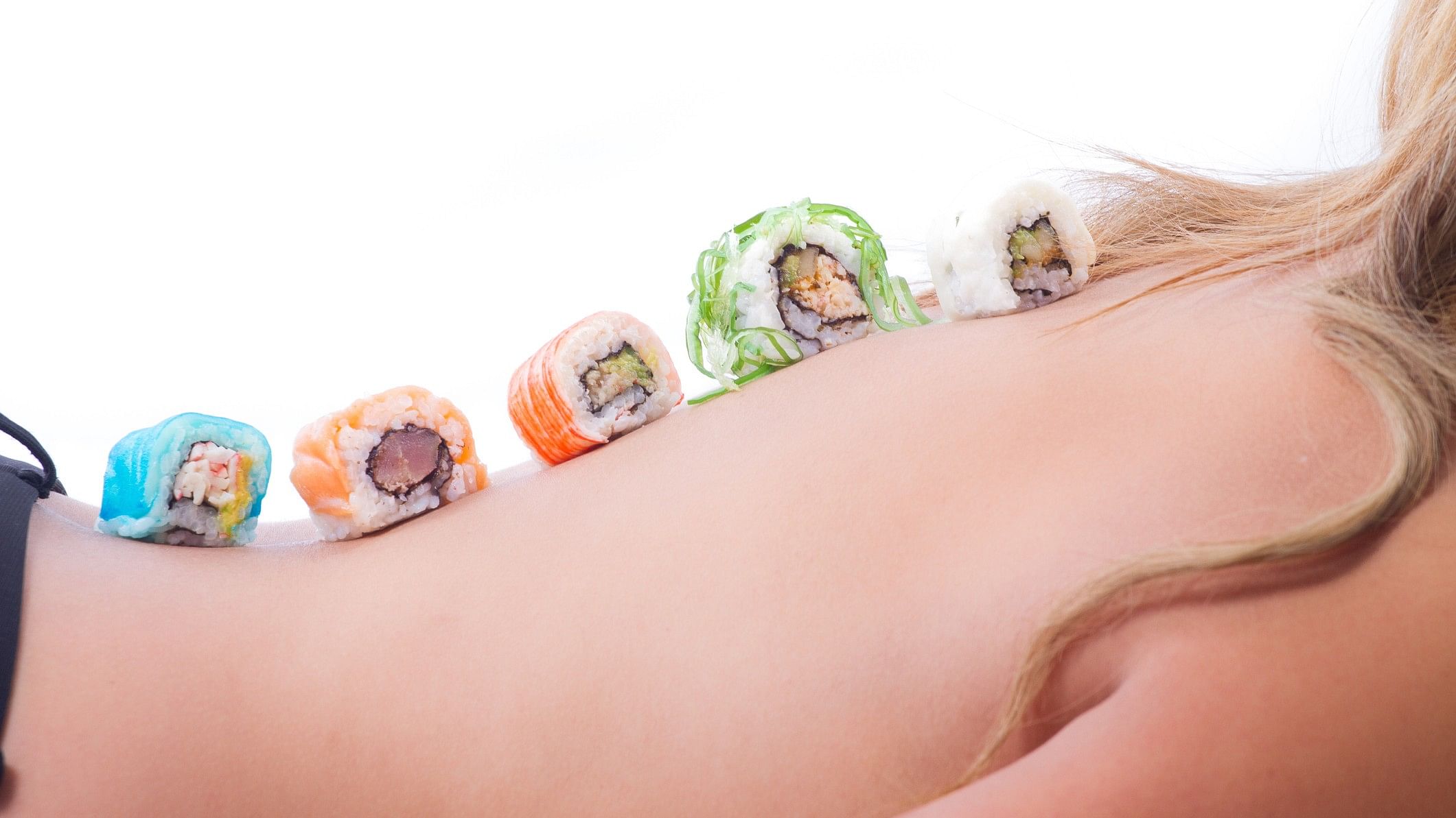<div class="paragraphs"><p>Representative image showing sushi rolls on a woman's body.</p></div>