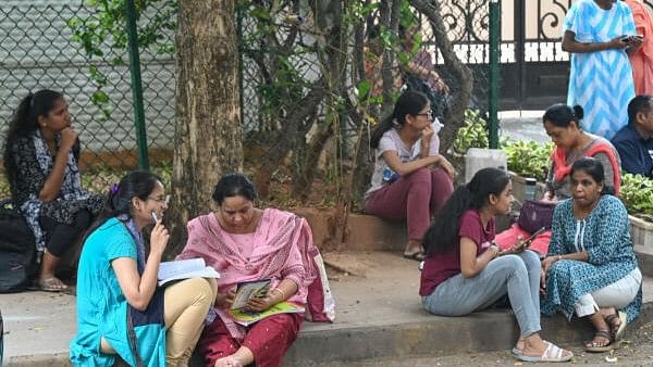 <div class="paragraphs"><p>Students preparing before enter in to centre for written The Karnataka Common Entrance Test (KCET) </p></div>