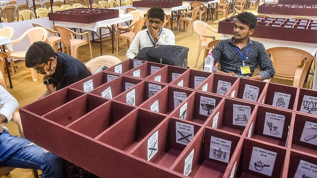 <div class="paragraphs"><p>Polling officials at a counting centre.</p></div>