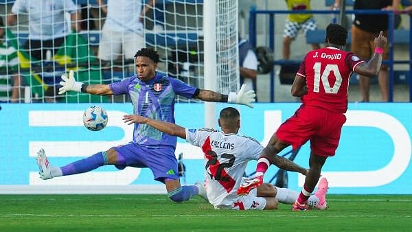 <div class="paragraphs"><p>Canada forward Jonathan David (10) scores a goal against Peru goalkeeper Pedro Gallese (1) during the second half of a Copa America match at Children's Mercy Park. </p></div>