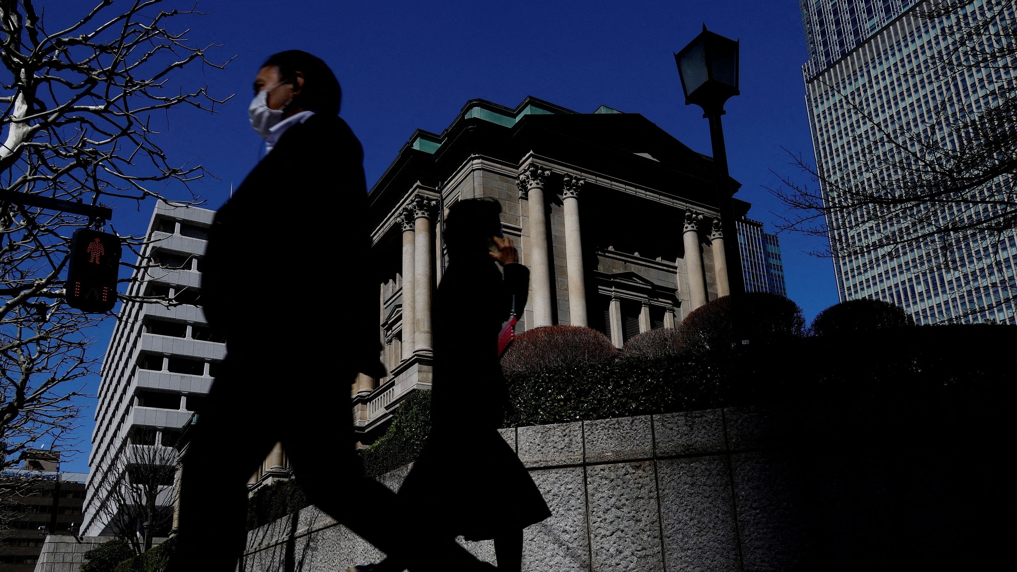 <div class="paragraphs"><p>FILE PHOTO: Pedestrians walk past the Bank of Japan building in Tokyo, Japan March 18, 2024. </p></div>