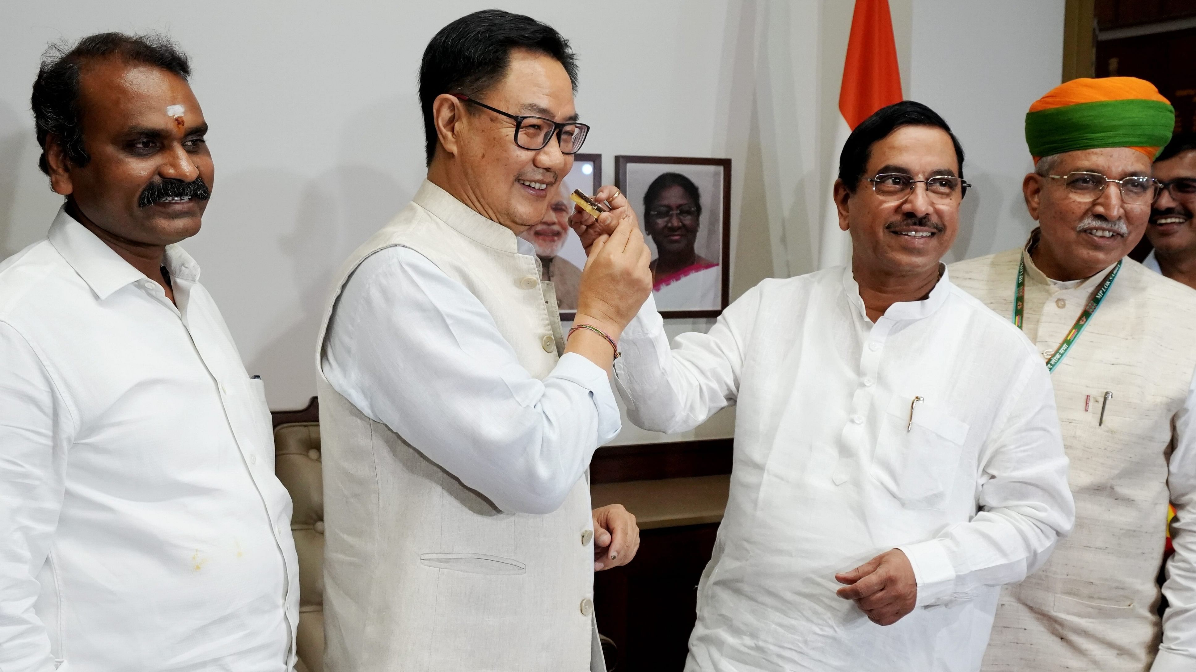 <div class="paragraphs"><p>Kiren Rijiju being greeted by L Murugan, Arjun Ram Meghwal and Pralhad Joshi after he took charge as Parliamentary Affairs Minister a day after the portfolio allocation, in New Delhi, Tuesday, June 11, 2024. </p></div>