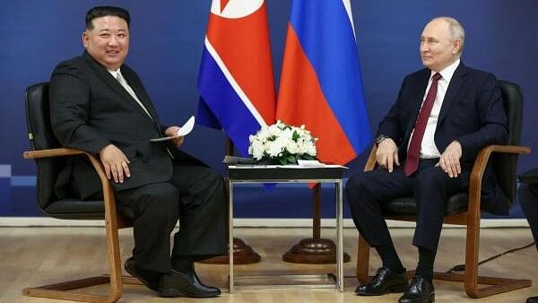 <div class="paragraphs"><p>Russia's President Vladimir Putin (R) and North Korea's leader Kim Jong Un (L).</p></div>