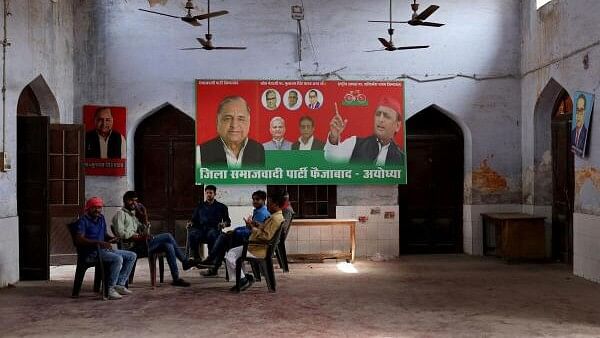 <div class="paragraphs"><p>Members of Samajwadi Party sit inside their party office, a day after India's general election results, in Ayodhya.</p></div>