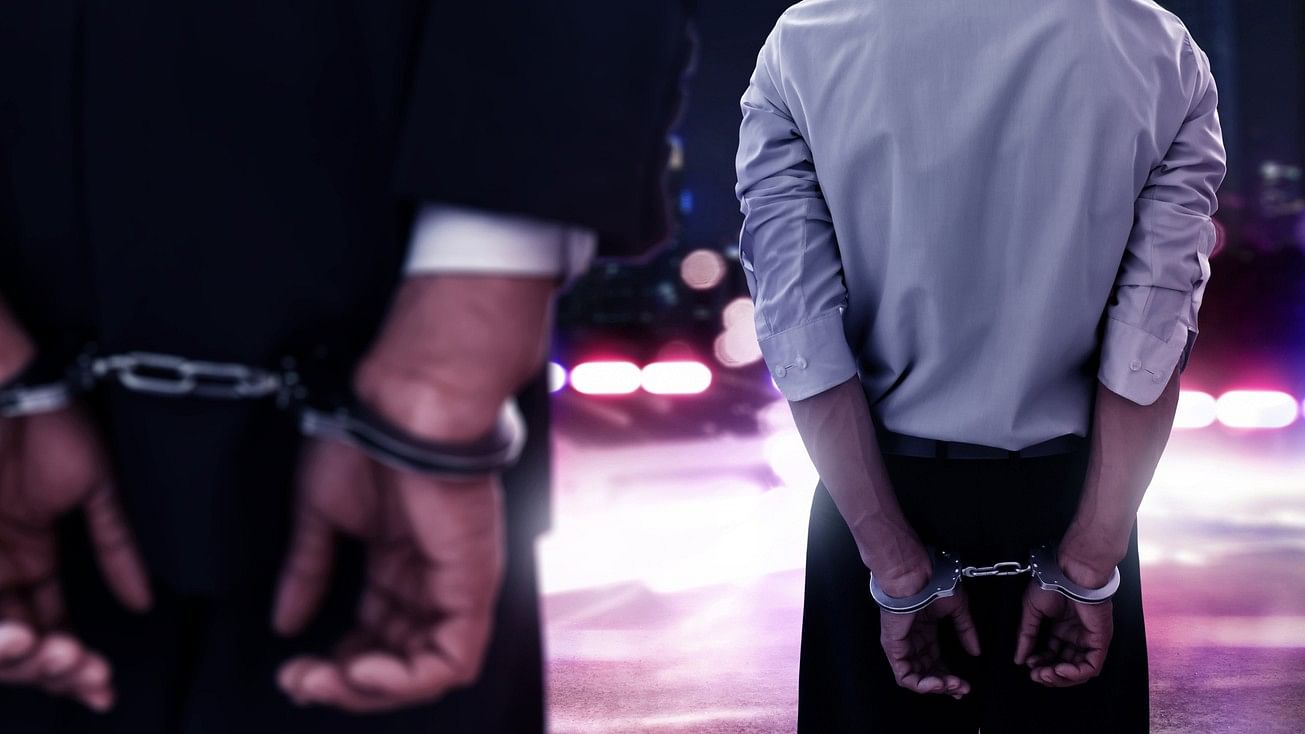 <div class="paragraphs"><p>Representative image showing two men in handcuffs.</p></div>