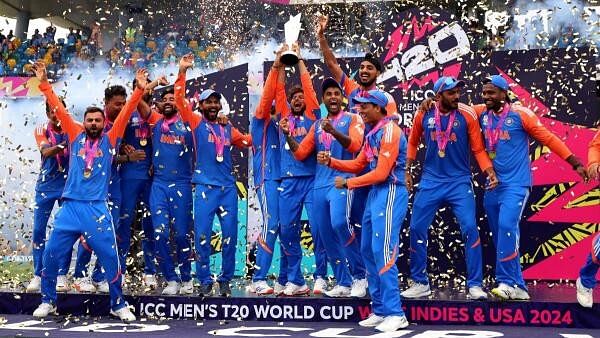 <div class="paragraphs"><p>India's Kuldeep Yadav lifts the trophy as they celebrate after winning the T20 World Cup.</p></div>