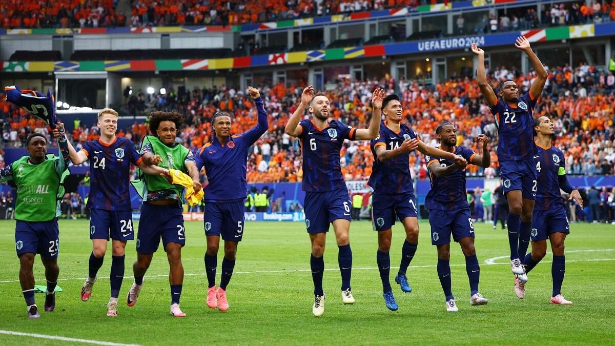 <div class="paragraphs"><p>Netherlands players celebrate after the match against Poland.</p></div>