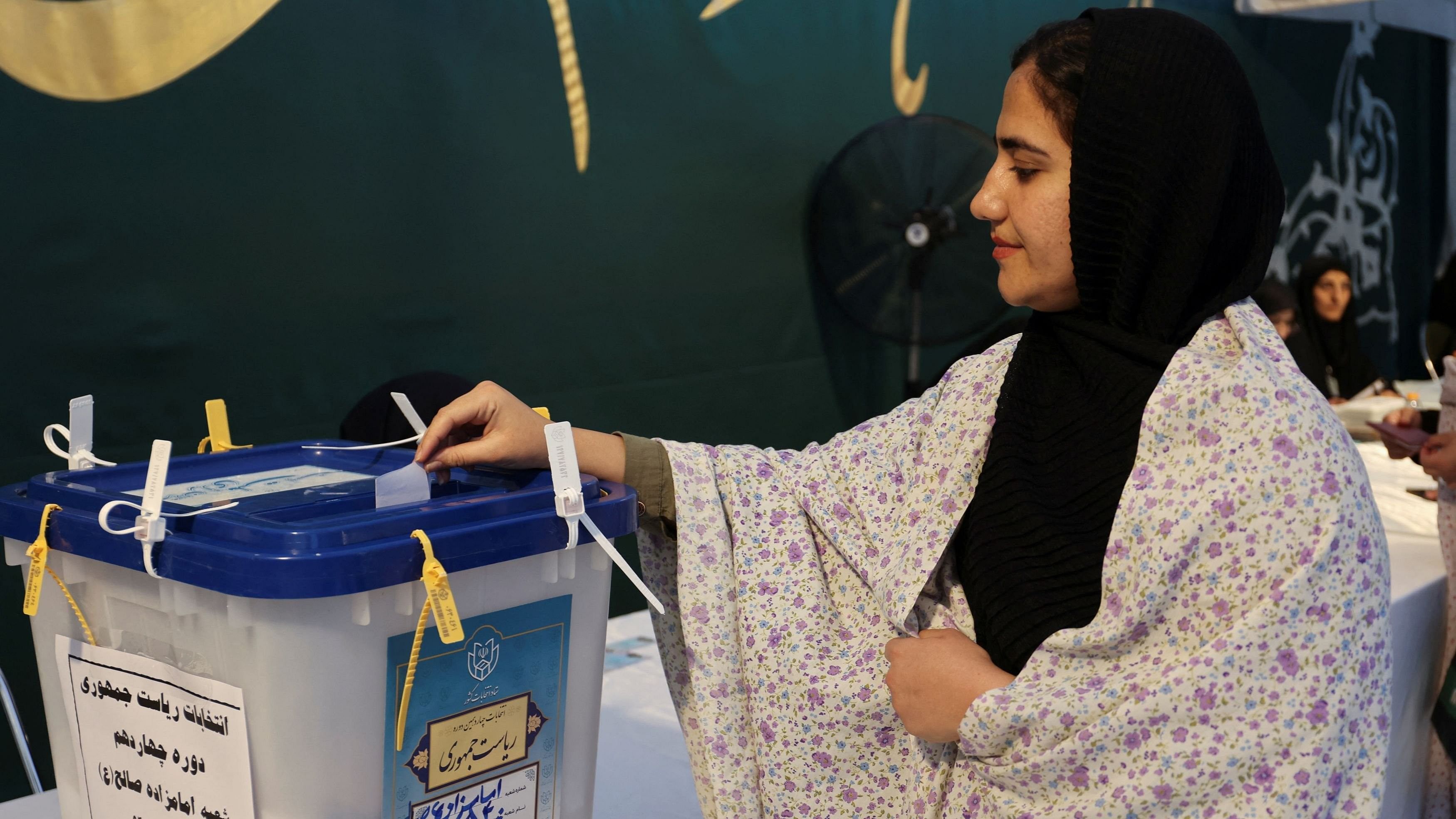 <div class="paragraphs"><p>An Iranian woman votes at a polling station in a snap presidential election to choose a successor to Ebrahim Raisi following his death in a helicopter crash, in Tehran, Iran June 28, 2024. </p></div>