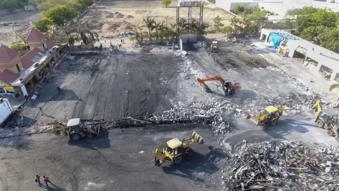 <div class="paragraphs"><p>Debris being removed from the game zone site where a fire broke out on Saturday, in Rajkot.</p></div>