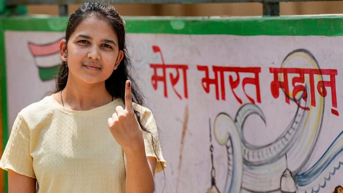 <div class="paragraphs"><p>A first time voter shows her finger marked with indelible ink after casting vote for the third phase of Lok Sabha elections, in Hathras, Uttar Pradesh, Tuesday, May 7, 2024. </p></div>