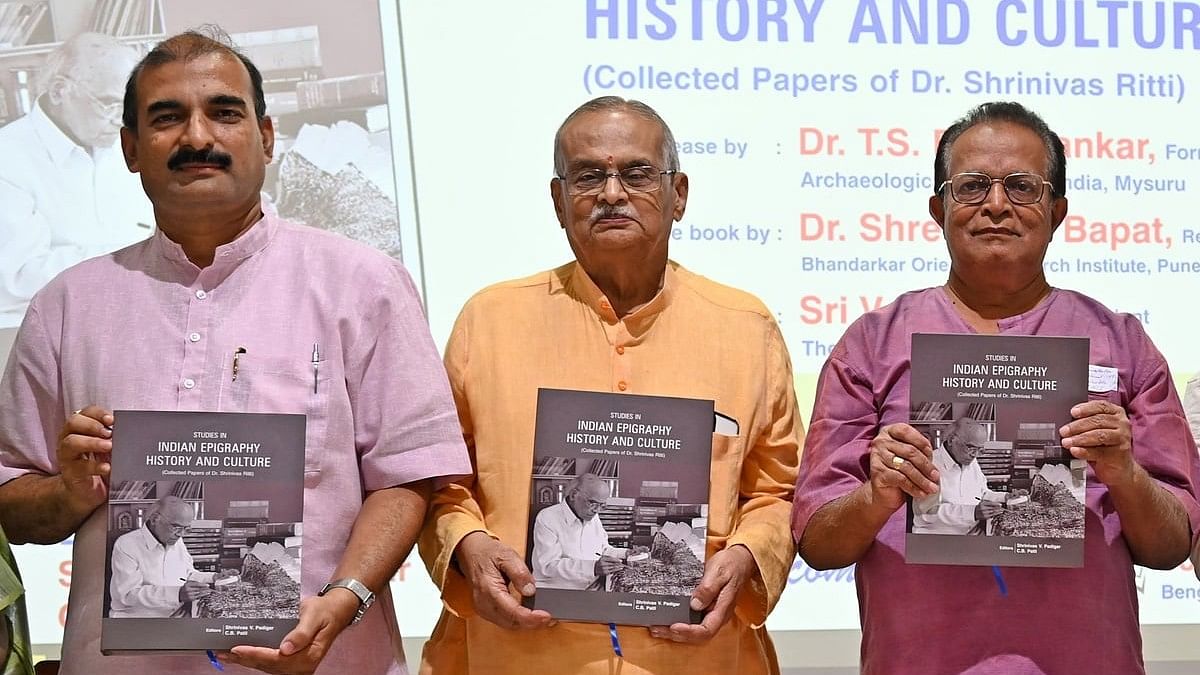 <div class="paragraphs"><p>(L-R) Dr Shreenand Bapat, Registrar, Bhandarkar Oriental Research Institute, Pune; V Nagaraj, President, The Mythic Society, and Dr TS Ravishankar, Former Director (Epigraphy), ASI, Mysuru, release a book titled 'Studies in Indian Epigraphy, History and Culture', a collected papers of Dr Shrinivas Ritti at The Mythic Society in Bengaluru on Sunday. </p></div>