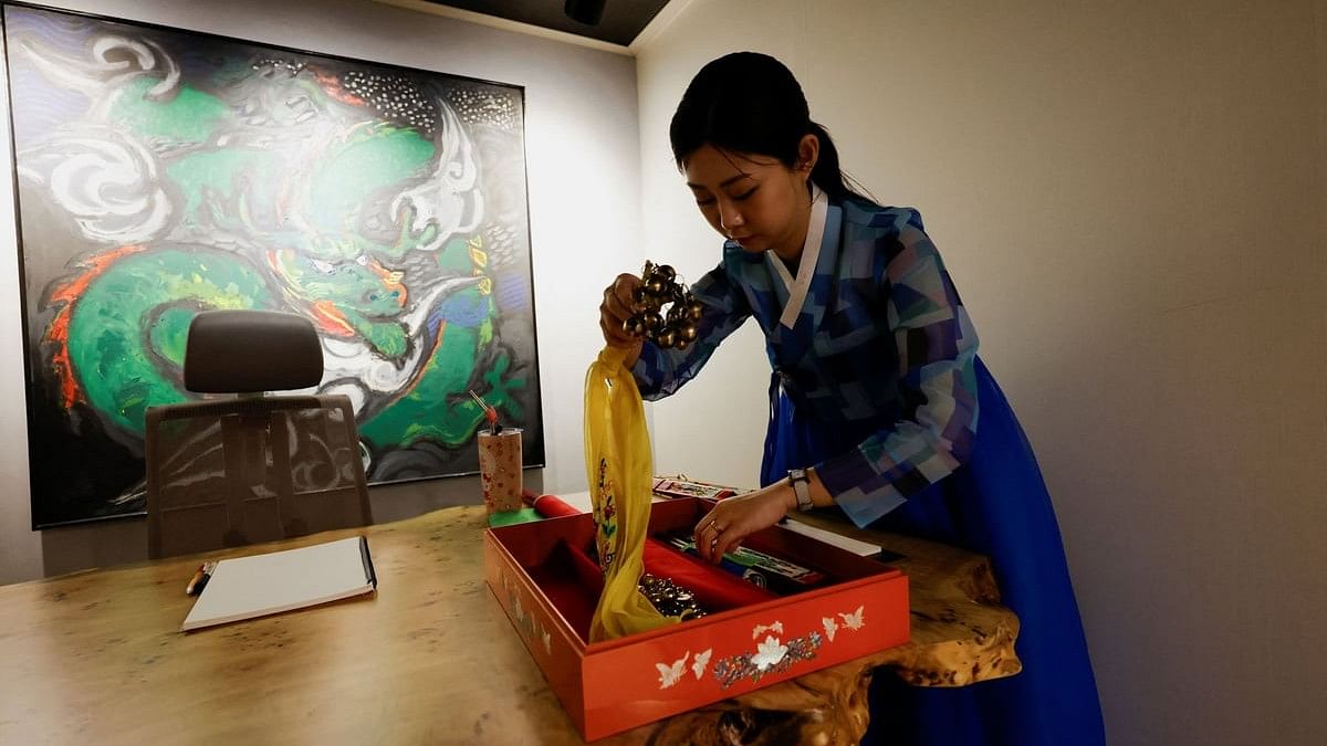 <div class="paragraphs"><p>Lee Kyoung-hyun, a popular YouTuber shaman, organises tools for fortune-telling at her shaman parlour in Seoul, South Korea.</p></div>