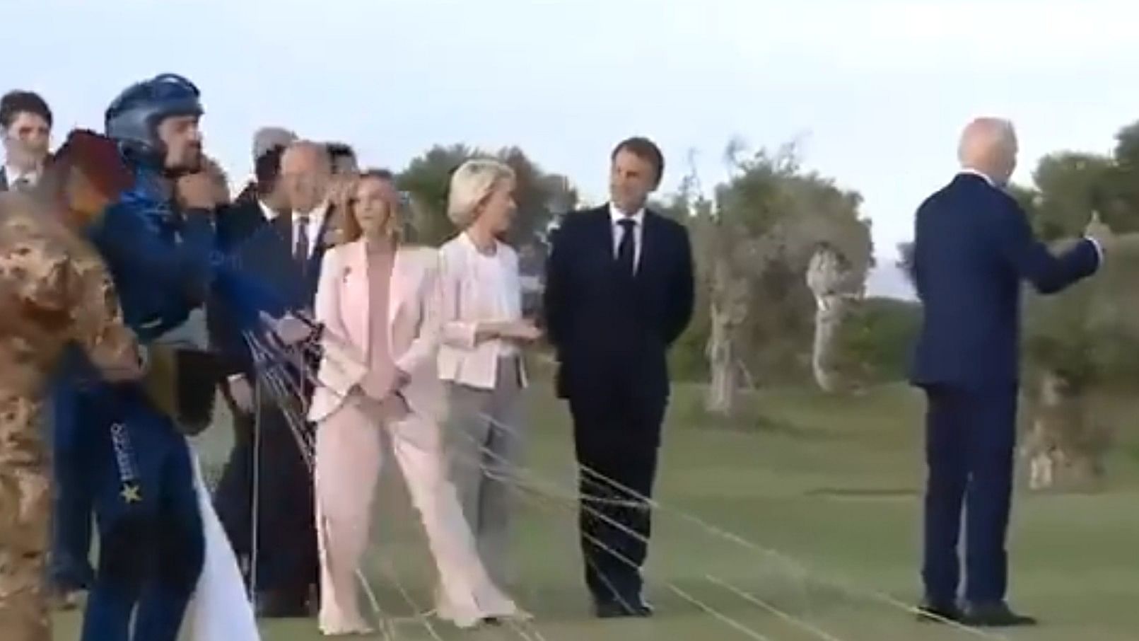 <div class="paragraphs"><p>Screengrab of video shows Biden raising his thumb, away from the group of G7 leaders</p></div>