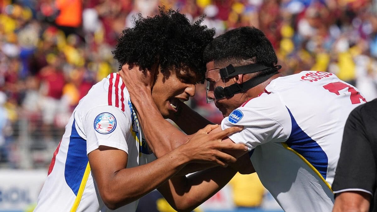 <div class="paragraphs"><p>Venezuela forward Eduardo Bello (left) celebrates with defender Yordan Osorio (right) after scoring a goal against Ecuador during the second half at Levi's Stadium.</p></div>