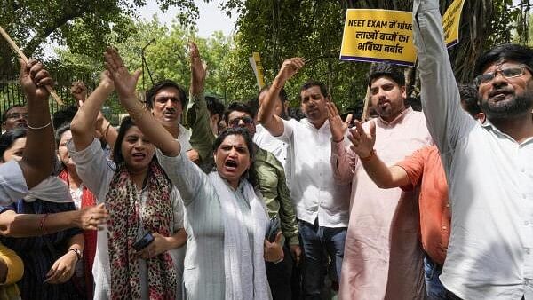 <div class="paragraphs"><p>Members of AAP youth and student's wing stage a protest against the alleged irregularities in NEET 2024 exam results, near Education Minister Dharmendra Pradhan's residence, in New Delhi, Wednesday, June 19, 2024.</p></div>