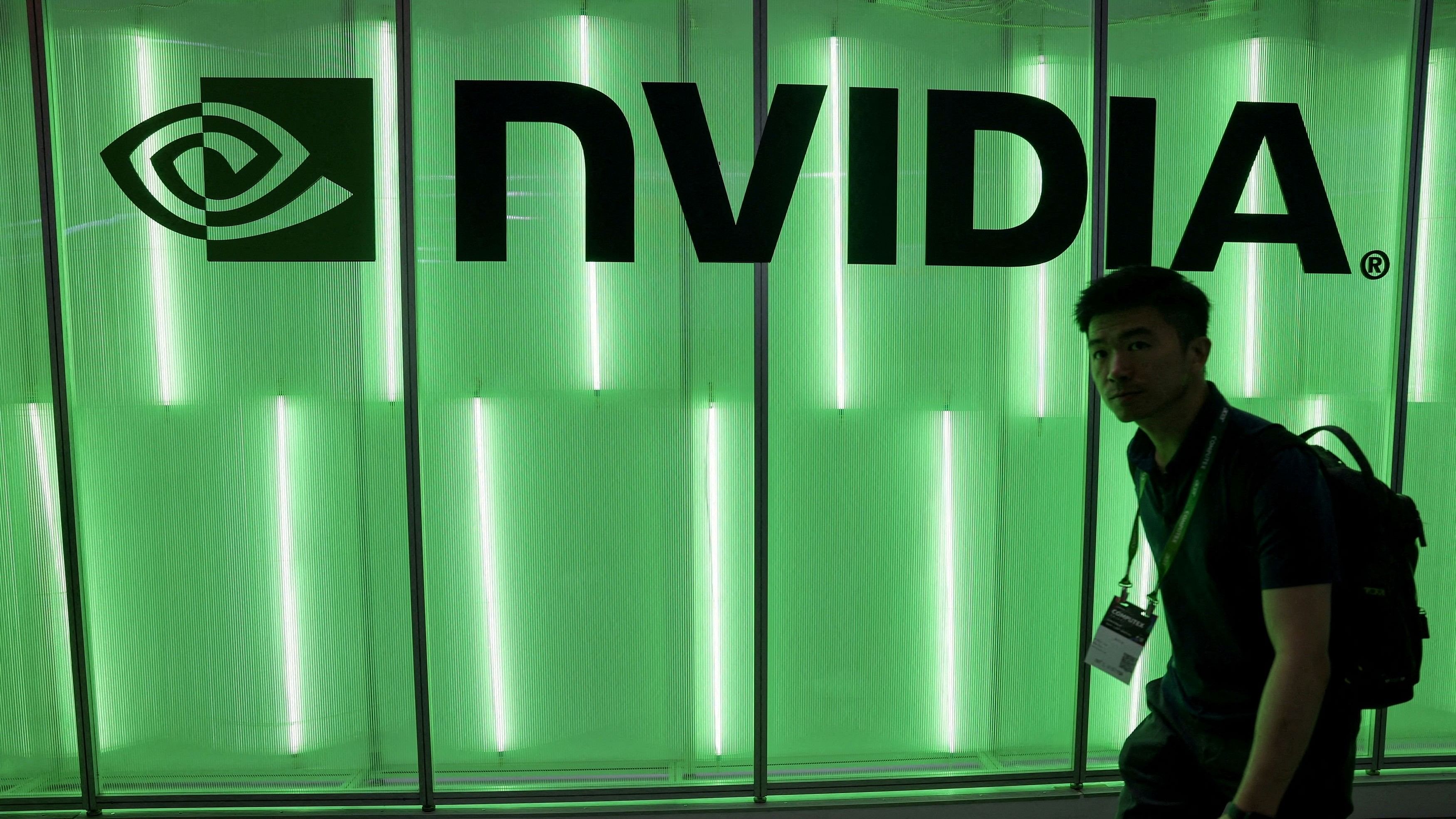 <div class="paragraphs"><p>A person walks pass a Nvidia logo  </p></div>