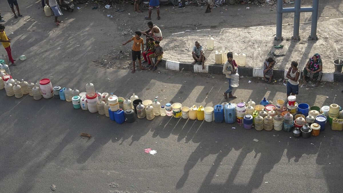 <div class="paragraphs"><p>New Delhi: People wait to collect drinking water from a tanker of Delhi Jal Board on a hot summer day as water crisis continues, at a slum in Geeta Colony area, in East Delhi, Saturday, June 15, 2024</p></div>