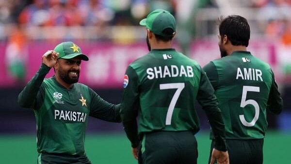 <div class="paragraphs"><p> Pakistan's Babar Azam celebrates with Mohammad Amir and Shadab Khan.</p></div>