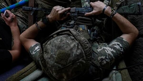 <div class="paragraphs"><p>Ukrainian serviceman holds a Kalashnikov AK-74 assault rifle at an undisclosed location near a front line in Donetsk region.</p></div>