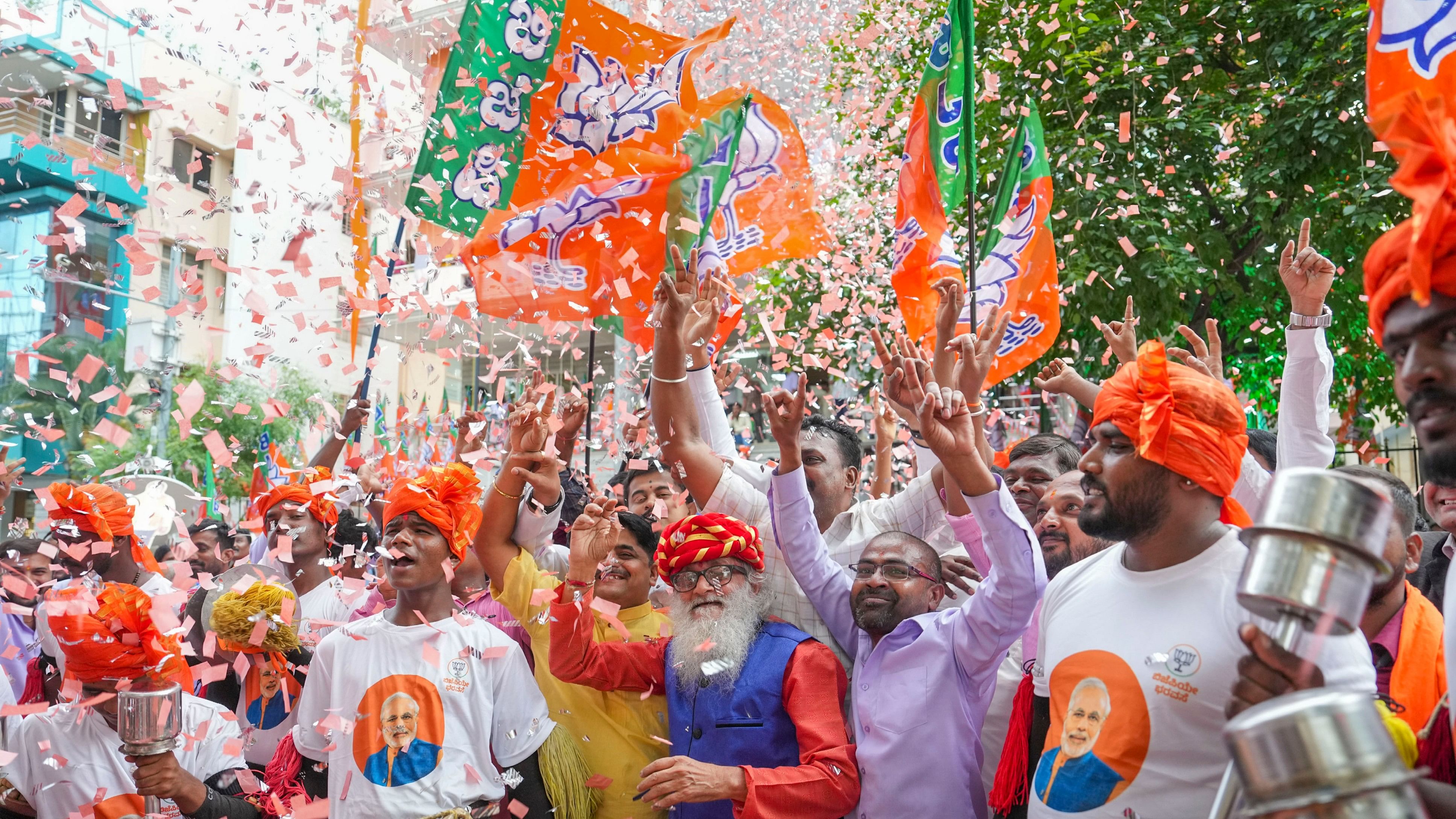 <div class="paragraphs"><p>NDA supporters celebrate poll results.</p></div>