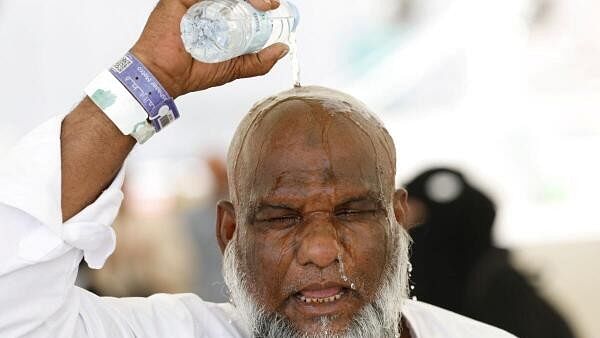 <div class="paragraphs"><p>A Muslim pilgrim pours water on his head to cool down from the heat, as he takes part in the annual haj pilgrimage in Mina, Saudi Arabia, June 17, 2024.</p></div>