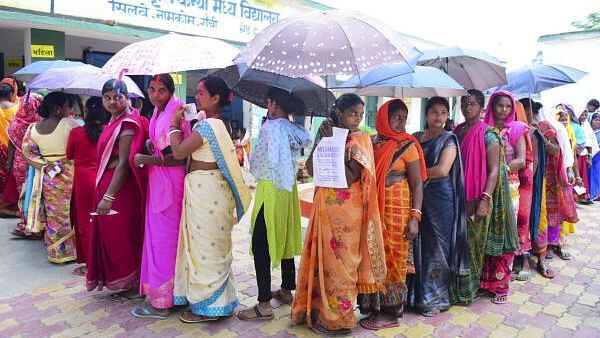 <div class="paragraphs"><p>Voters wait to cast their votes for the&nbsp;seventh phase of Lok Sabha elections in Jharkhand.</p></div>