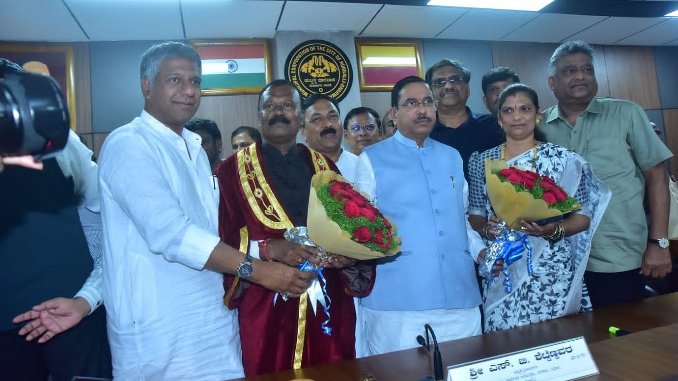 <div class="paragraphs"><p>Deputy Leader of Opposition in Legislative Assembly Arvind Bellad and Union minister Pralhad Joshi wish newly-elected mayor Ramappa (Ramanna) Badiger and deputy mayor Durgamma Bijwad, in Hubballi on Saturday.</p></div>