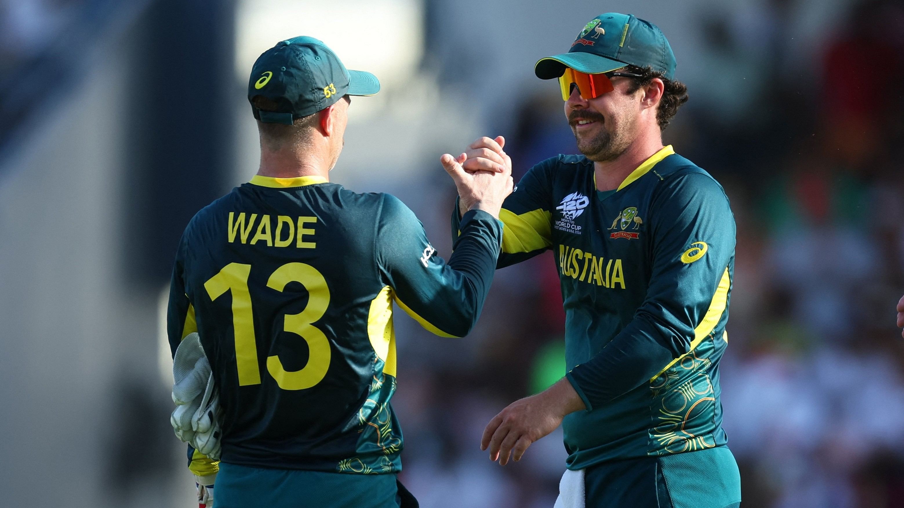 <div class="paragraphs"><p> Australia's Matthew Wade and Travis Head celebrate during a match in the ongoing T20 World Cup.</p></div>