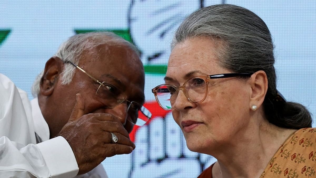 <div class="paragraphs"><p>Mallikarjun Kharge, president of the Congress party, speaks to Sonia Gandhi during a press conference at the party's headquarters in New Delhi.</p></div>