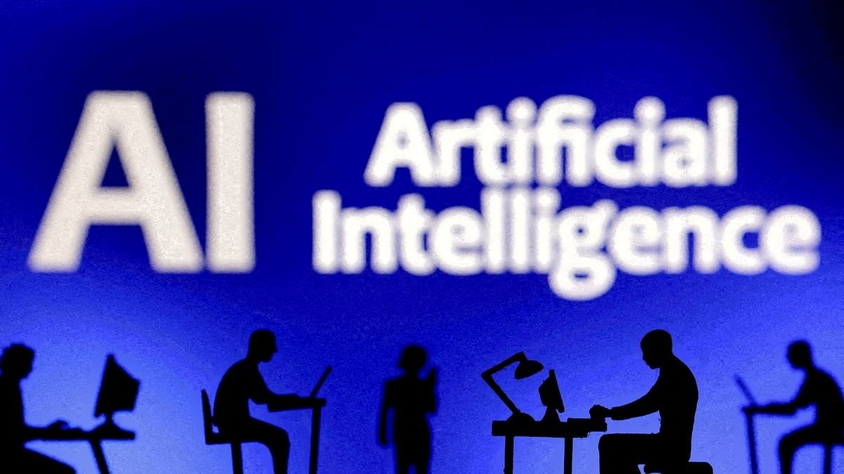 <div class="paragraphs"><p>Figurines with computers and smartphones are seen in front of the words "Artificial Intelligence AI" in this illustration taken.</p></div>